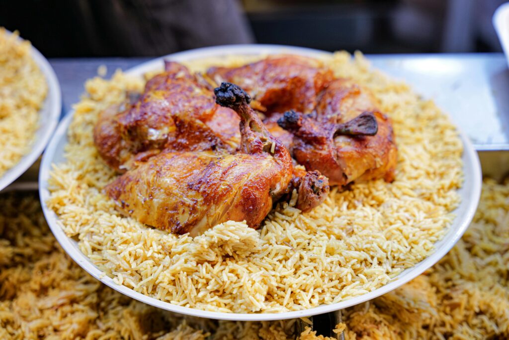 Close-up of a delicious chicken and rice meal served on a plate, perfect for food lovers.